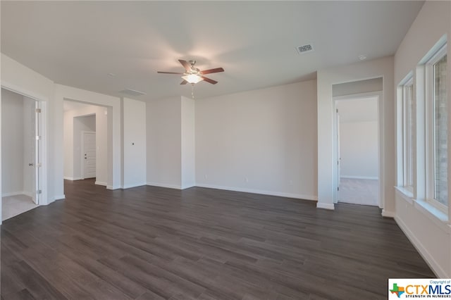 spare room with ceiling fan and dark hardwood / wood-style floors