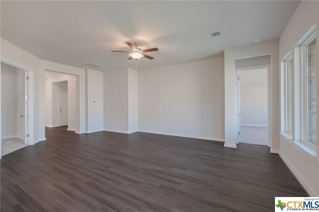 2258 Hoja Ave, New Braunfels, TX 78132 - unfurnished living room with a ceiling fan, dark wood-type flooring, and baseboards