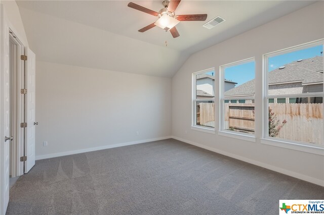 bonus room with carpet floors, ceiling fan, and vaulted ceiling