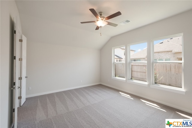 additional living space with vaulted ceiling, carpet flooring, and ceiling fan