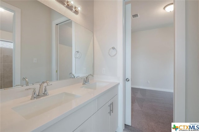2258 Hoja Ave, New Braunfels, TX 78132 - full bathroom with double vanity and baseboards