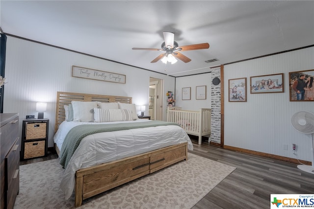 bedroom featuring ceiling fan and dark wood-type flooring