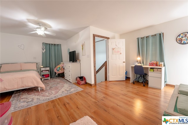 bedroom with ceiling fan and light hardwood / wood-style floors