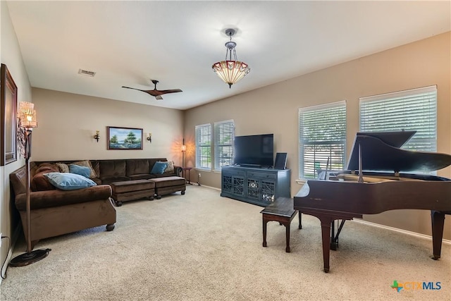 living area featuring baseboards, carpet, and visible vents