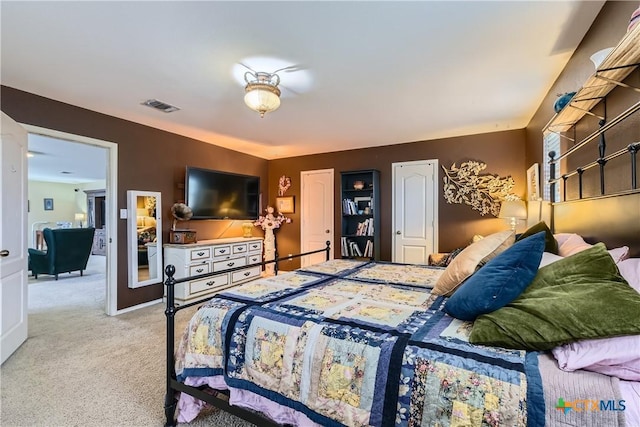 carpeted bedroom with visible vents