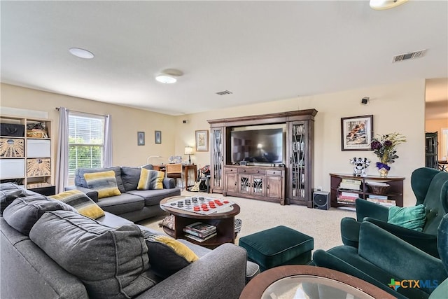 living room featuring visible vents and carpet floors