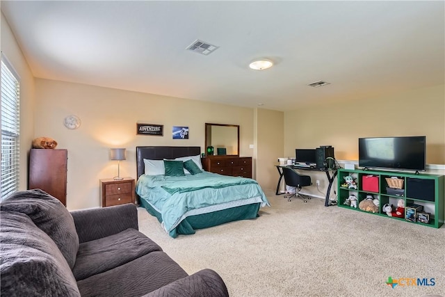 carpeted bedroom with visible vents