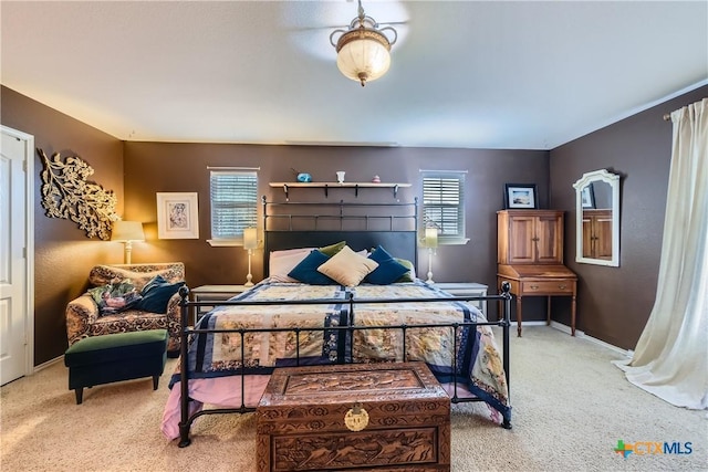 carpeted bedroom featuring baseboards