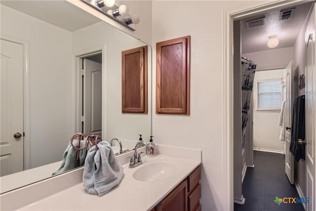 bathroom featuring visible vents and vanity