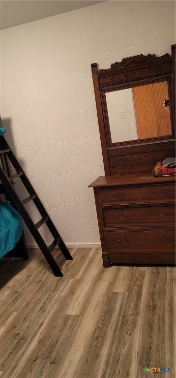 stairway featuring hardwood / wood-style floors