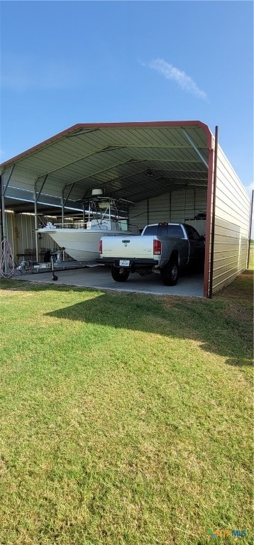 view of car parking with a yard and a carport