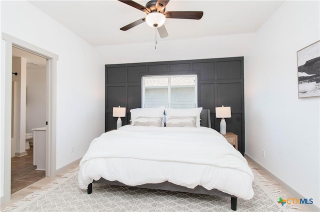 bedroom featuring baseboards, a ceiling fan, and light colored carpet