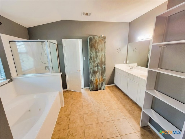 9200 Ashlyn Dr, Killeen, TX 76542 - full bathroom with a shower stall, a whirlpool tub, double vanity, tile patterned floors, and lofted ceiling