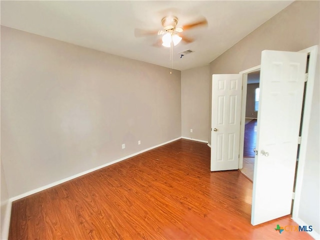 9200 Ashlyn Dr, Killeen, TX 76542 - unfurnished bedroom featuring wood finished floors, lofted ceiling, and ceiling fan