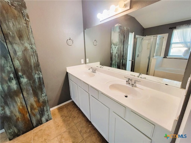 9200 Ashlyn Dr, Killeen, TX 76542 - full bathroom featuring a shower stall, double vanity, tile patterned floors, a bath, and lofted ceiling