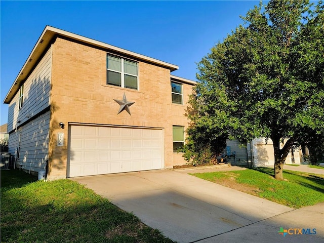 9200 Ashlyn Dr, Killeen, TX 76542 - view of front facade with a garage, concrete driveway, and a front yard