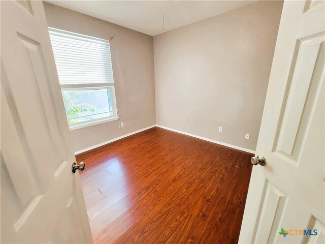 9200 Ashlyn Dr, Killeen, TX 76542 - unfurnished room featuring dark wood finished floors and baseboards