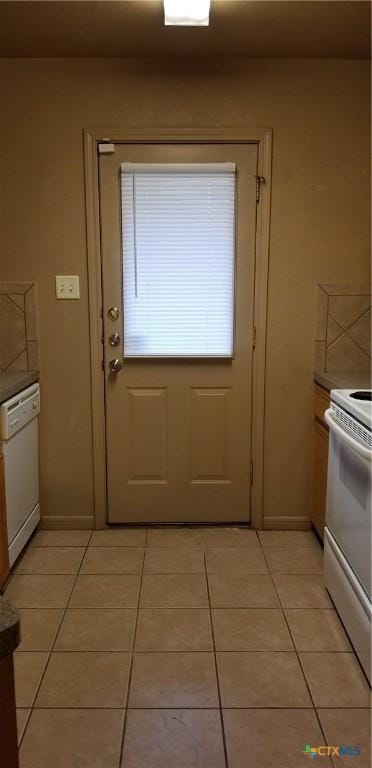 1207 Nicholas Cir, Killeen, TX 76542 - entryway with light tile patterned floors and baseboards