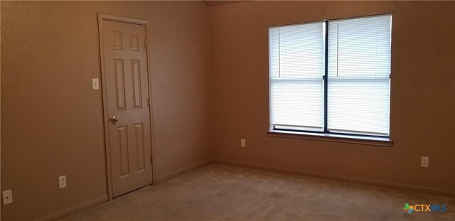 1207 Nicholas Cir, Killeen, TX 76542 - unfurnished room featuring light colored carpet and baseboards