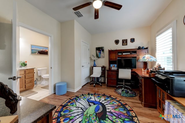 office area with ceiling fan and light hardwood / wood-style flooring