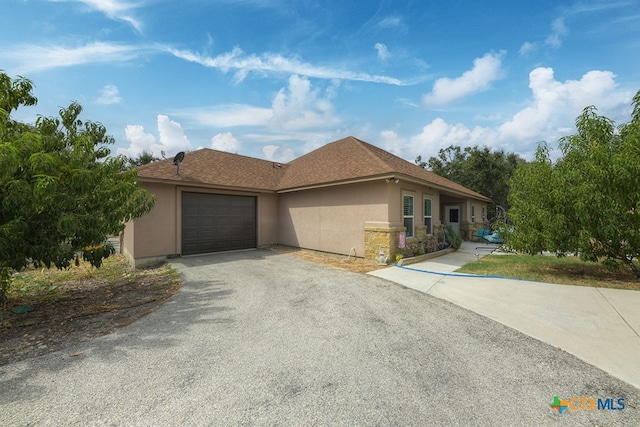 view of front of property with a garage