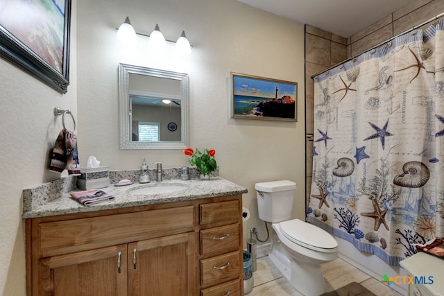 full bathroom featuring shower / bath combination with curtain, vanity, tile patterned floors, and toilet