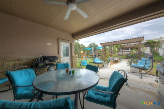 view of patio with ceiling fan and area for grilling