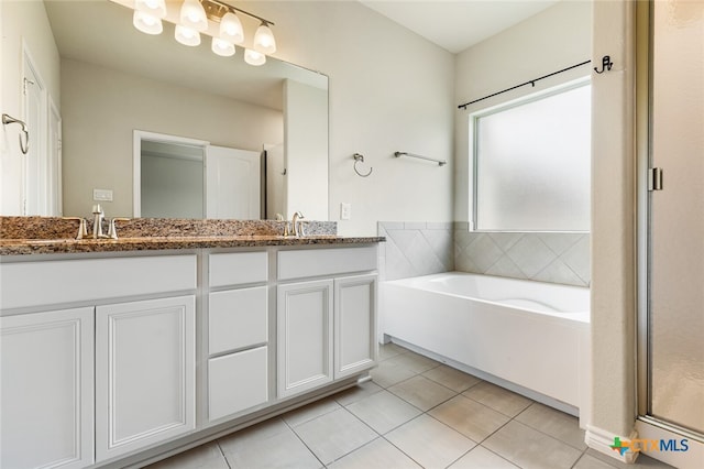 bathroom with tile patterned flooring, vanity, and plus walk in shower