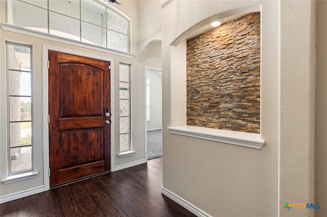 foyer with dark hardwood / wood-style floors