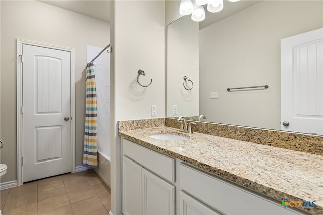 full bathroom with toilet, shower / bath combo, vanity, and tile patterned flooring