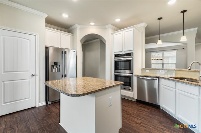 kitchen featuring stainless steel appliances, white cabinets, sink, and dark wood-type flooring