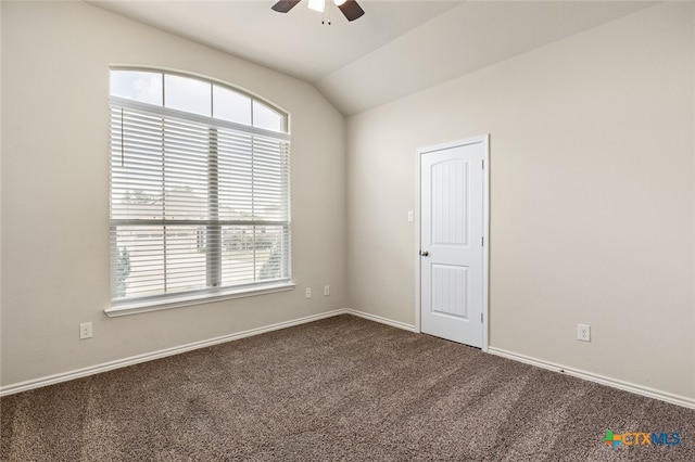 carpeted spare room with lofted ceiling and ceiling fan