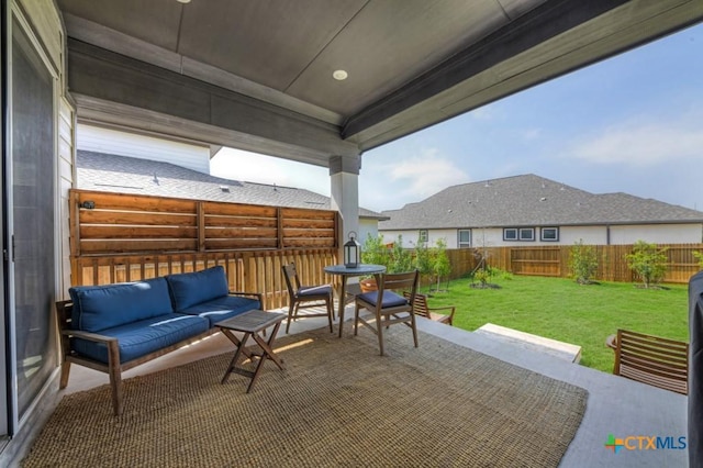 view of patio featuring outdoor lounge area and a fenced backyard