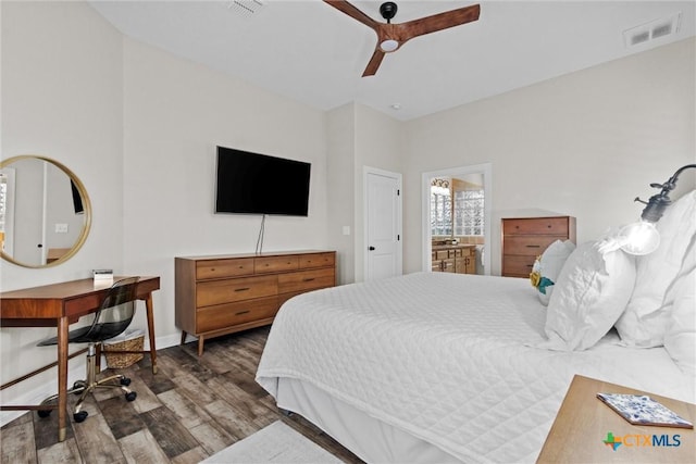 bedroom featuring a ceiling fan, baseboards, visible vents, and wood finished floors