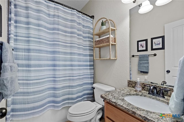 full bathroom featuring shower / tub combo with curtain, vanity, and toilet