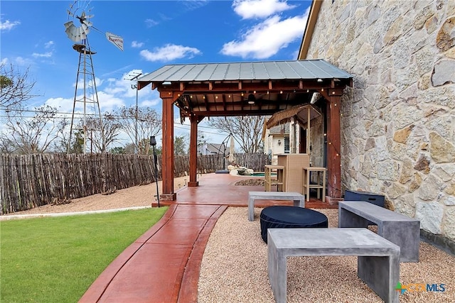 view of patio / terrace with a gazebo and a fenced backyard