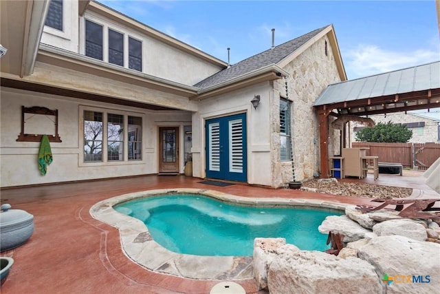 view of swimming pool with a patio area, a gazebo, fence, and french doors