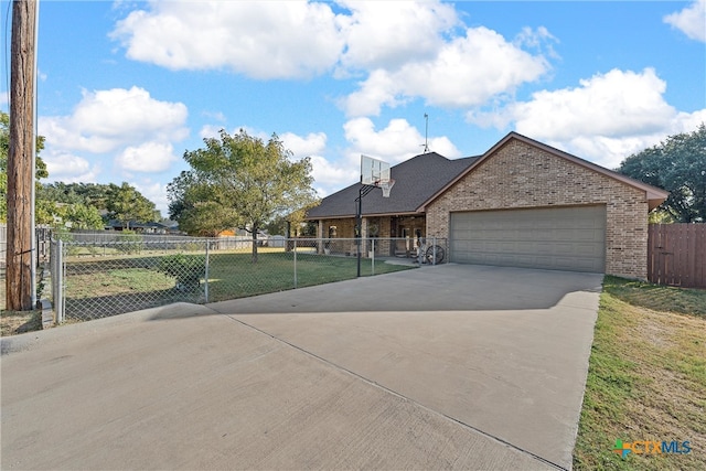 view of front of house with a garage and a front yard