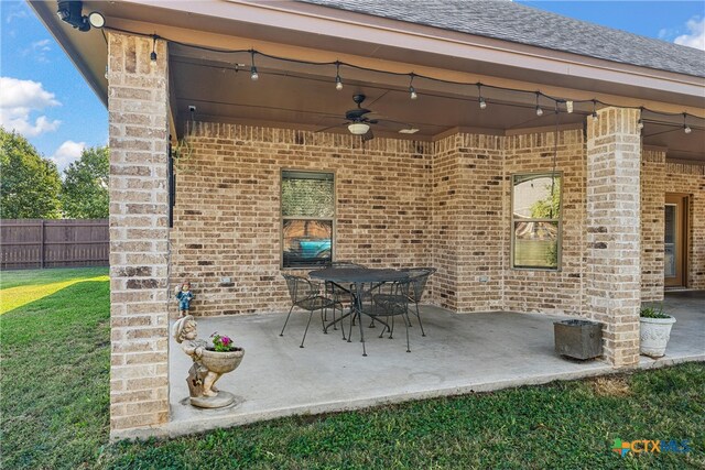 view of patio featuring ceiling fan