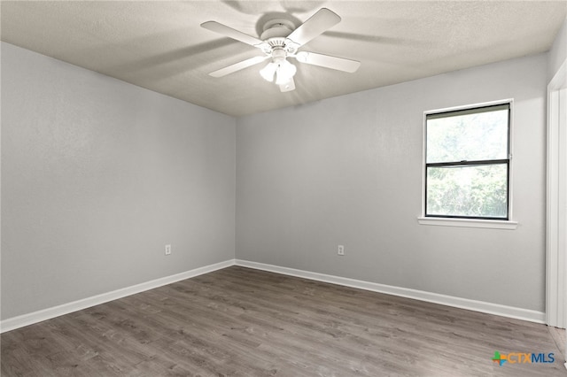 708 N 19th St, Copperas Cove, TX 76522 - empty room featuring dark wood-type flooring, a textured ceiling, and ceiling fan