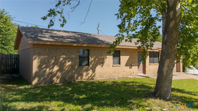 708 N 19th St, Copperas Cove, TX 76522 - view of side of home with brick siding and a shingled roof