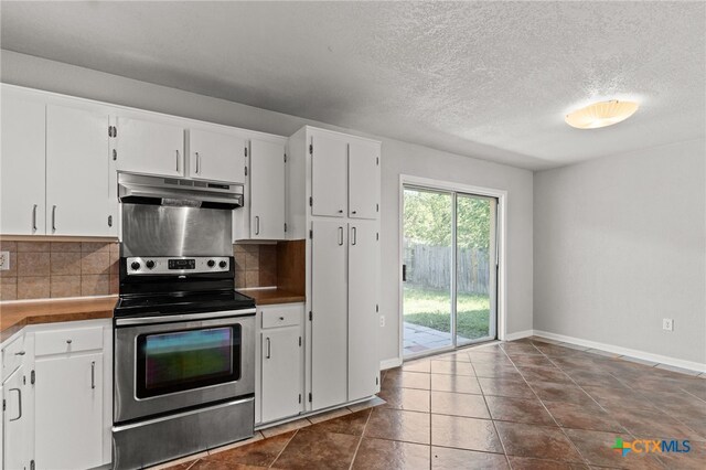708 N 19th St, Copperas Cove, TX 76522 - kitchen featuring stainless steel range with electric cooktop, under cabinet range hood, tasteful backsplash, white cabinetry, and a textured ceiling