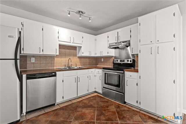 708 N 19th St, Copperas Cove, TX 76522 - kitchen featuring appliances with stainless steel finishes, under cabinet range hood, and white cabinetry