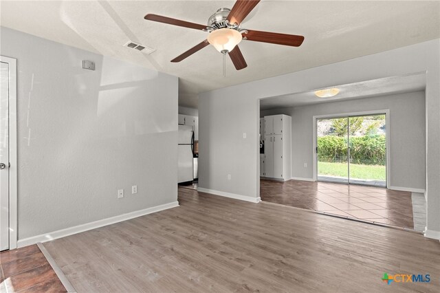 708 N 19th St, Copperas Cove, TX 76522 - unfurnished living room with wood finished floors and a ceiling fan