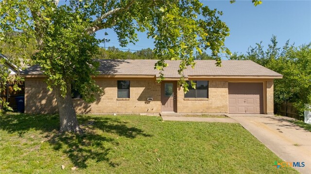 708 N 19th St, Copperas Cove, TX 76522 - ranch-style home with a garage, concrete driveway, a shingled roof, and brick siding