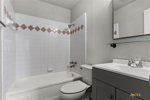 708 N 19th St, Copperas Cove, TX 76522 - full bathroom with a textured wall, vanity, and bathtub / shower combination