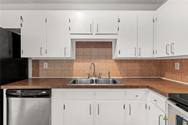 708 N 19th St, Copperas Cove, TX 76522 - kitchen featuring stainless steel dishwasher, white cabinetry, and backsplash