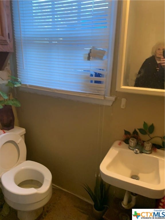 bathroom with toilet and sink