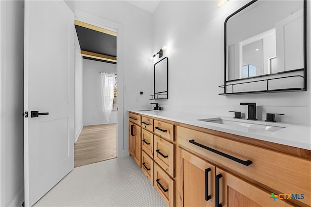 bathroom featuring vanity and hardwood / wood-style flooring