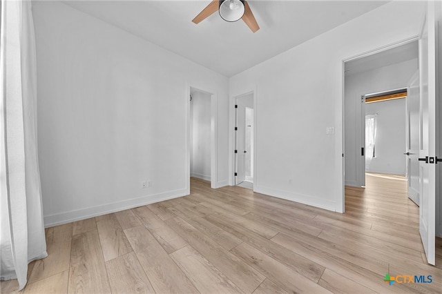 spare room featuring light hardwood / wood-style floors and ceiling fan